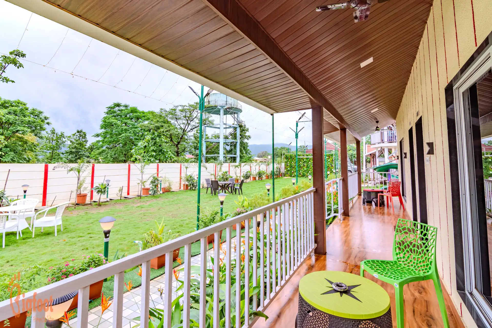 Balcony overlooking the garden lawn at JS Farm Resort, Karjat