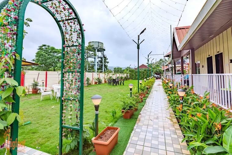 Resort cottages and open lawn at JS Farm Resort, Karjat
