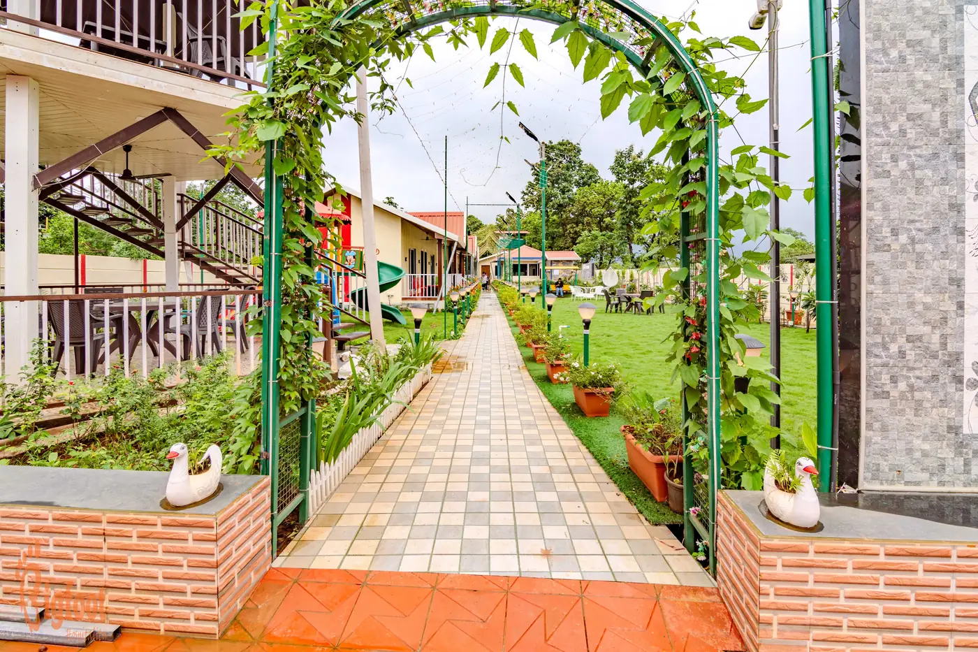 Open lawn and greenery at JS Farm Resort, Karjat